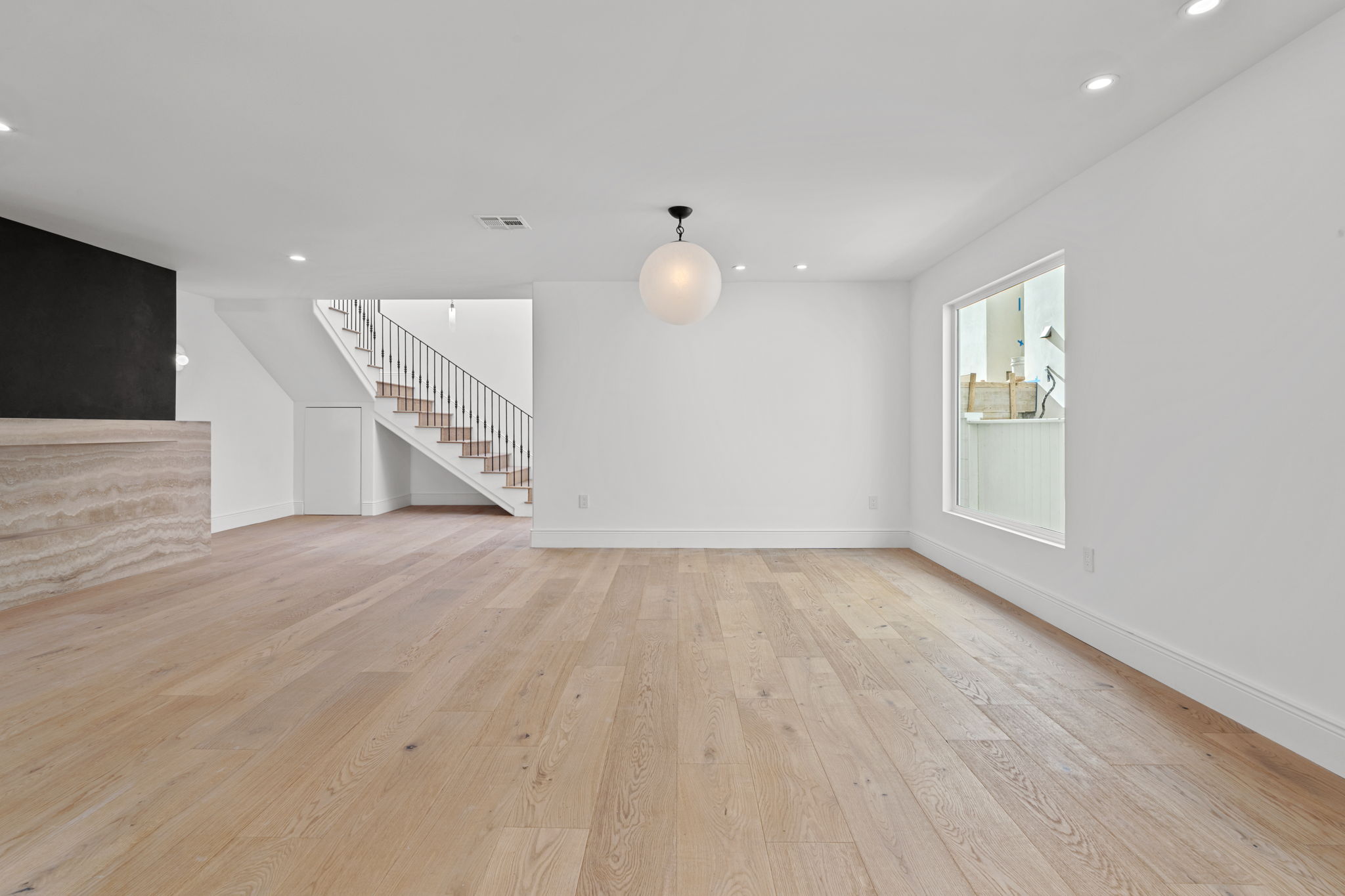 Wide plank wood floors in Manhattan Beach luxury interior remodel living space