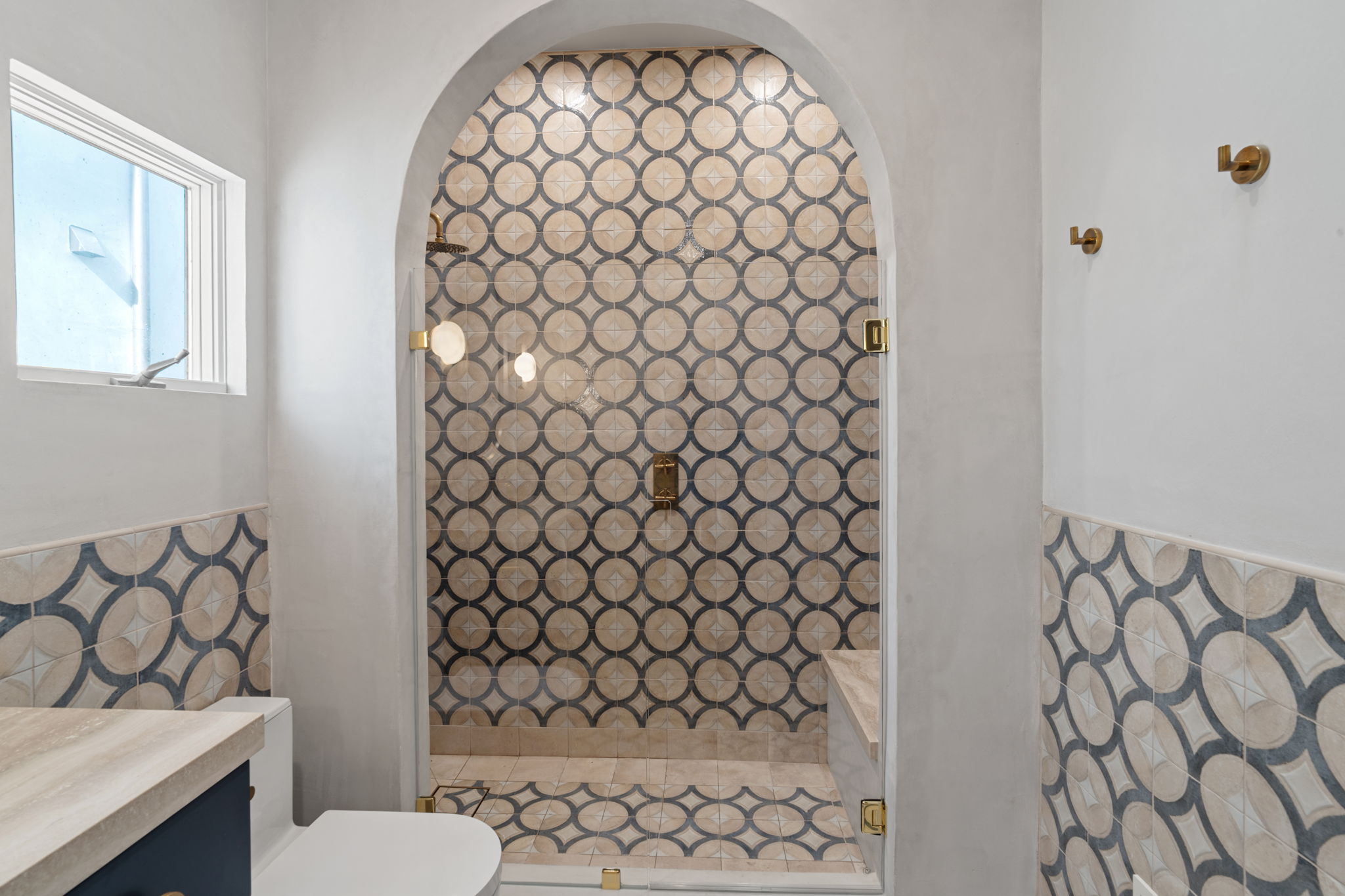 Arched shower entrance in Manhattan Beach luxury interior remodel bathroom
